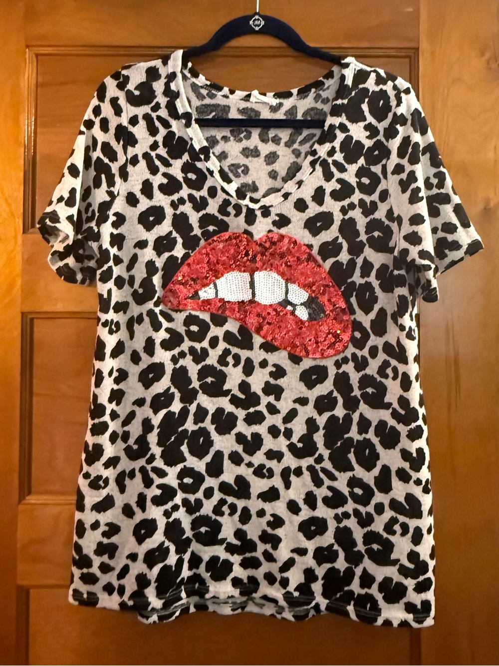 BiBi Cream Knit Top with Black Animal Print Pattern